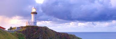 Cape Byron lighthouse at sunset on the top of a cliff