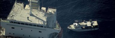 The 14 metre workboat Ogoi Ratz has been made ready for towing by the civilian ship MV Uni Sunshine following the discovery of the missing workboat. The Ogoi Ratz was found by an RAAF P-8A Poseidon maritime patrol aircraft during a dedicated search and rescue mission for the boat (photo taken by aircrew on the Poseidon aircraft).